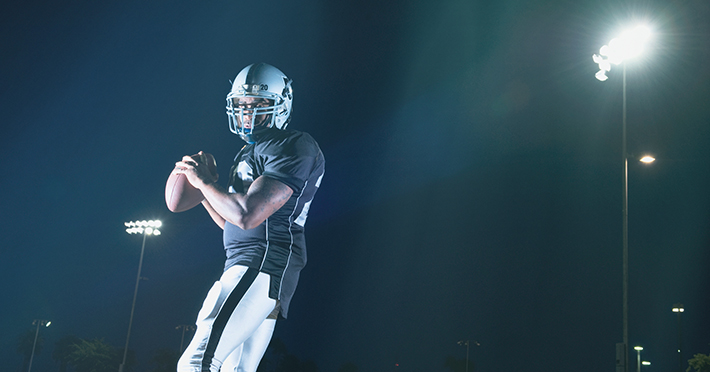 Football player throwing the ball